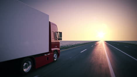 Animation-of-a-truck-on-the-road-with-the-clear-sunsetting-sky-background.-A-large-delivery-truck-is-moving-forward.-Cargo-delivery.-Lorry-with-a-huge-capacity-trailer.-Overall-side-view.-HD