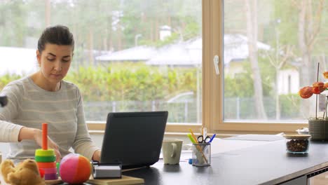 Young-Woman-is-Working-at-Home-on-a-Laptop.focused-woman-wearing-glasses-typing-over-the-keyboard-of-her-laptop-while-sitting-at-home.-concentrated-female-freelancer-working.-remote-work,-self-employment-and-study,-solving-task,-research.