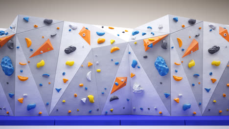 Loop-animation-of-artificial-climbing-or-bouldering-wall.-Rock-extreme-sport-activity-for-indoor-training-and-exercise-at-leisure-time.-Loopable-empty-gym-with-many-colorful-holds.