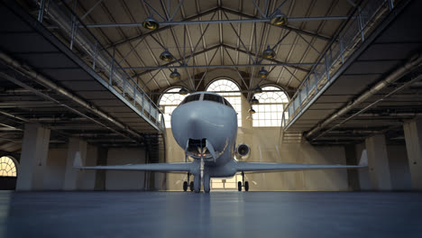 Timelapse-of-a-private-jet-in-the-loft-warehouse.-Shiny,-white-civil-aircraft-in-a-modern-hangar.-Expensive-transportation-vehicle-for-rich-people.-Light-shafts-pouring-through-the-windows.