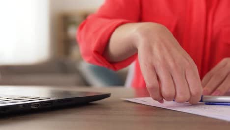 Vertical-Freelance-Work-Woman-Laptop-Couch-Home.Vertical-video.-Freelance-work.-Modern-technology.-Smiling-woman-in-casual-cloth-sitting-with-laptop-on-comfortable-couch-in-light-living-room-interior-at-home.