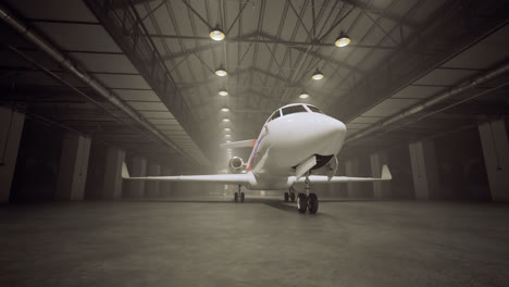 Timelapse-of-a-private-jet-in-the-loft-warehouse.-Shiny,-white-civil-aircraft-in-a-modern-hangar.-Expensive-transportation-vehicle-for-rich-people.-Light-shafts-pouring-through-the-windows.