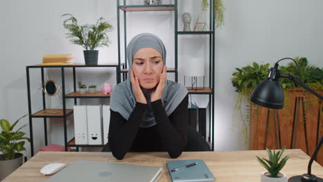 Sad-young-muslim-business-woman-looks-pensive-thinks-over-life-concerns-problem-break-up-depressed