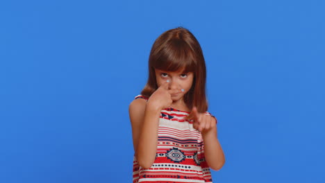 School-child-girl-show-pointing-at-her-eyes-and-camera-I-am-watching-you-gesture,-spying-on-someone