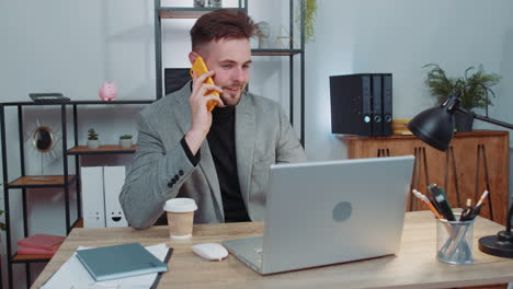 Business-man-in-suit-working,-having-mobile-phone-talk-at-office-workplace-using-messenger-chat-apps