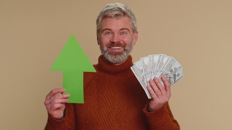 Happy-man-winner-holding-arrow-sign-pointing-up,-career-growth-and-money-dollar-exchange-increase