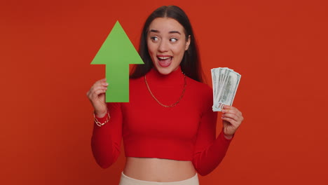 Happy-woman-winner-holding-arrow-sign-pointing-up,-career-growth-and-money-dollar-exchange-increase