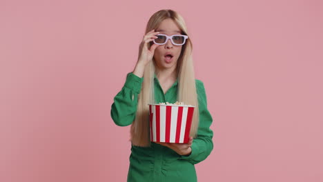 Woman-in-3D-glasses-eating-popcorn-and-watching-interesting-tv-serial,-sport-game-film-online-movie