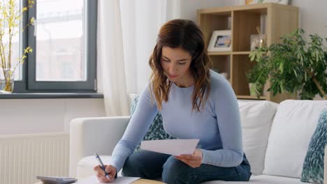 Grey-Haired-Senior-Woman-Working-With-Papers-And-Calculating-Payment.Elderly-Woman-With-Grey-Hair-Working-On-Paperwork-And-Calculating-Bills