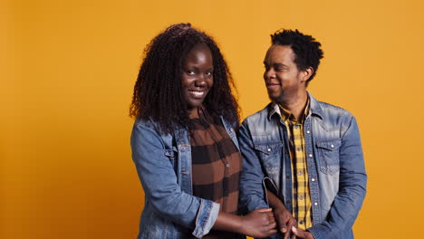 African-american-life-partners-smiling-and-looking-at-each-other