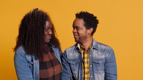 African-american-life-partners-smiling-and-looking-at-each-other