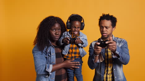 Enthusiastic-father-playing-online-video-games-with-baby-boy-using-controller