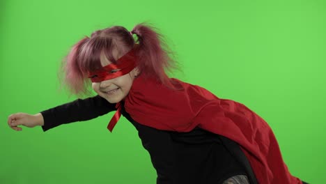 Funny-child-girl-in-costume-and-mask-plays-super-hero.-National-superhero-day