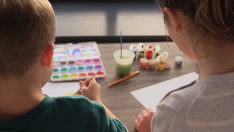 Asian-Mother-and-little-son-drawing-and-coloring-with-Crayons.Asian-Mother-and-little-son-drawing-and-coloring-with-Crayons.-Woman-and-little-child-boy-enjoy-painting-with-Crayons-on-paper-together.