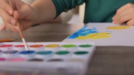 Asian-Mother-and-little-son-drawing-and-coloring-with-Crayons.Asian-Mother-and-little-son-drawing-and-coloring-with-Crayons.-Woman-and-little-child-boy-enjoy-painting-with-Crayons-on-paper-together.