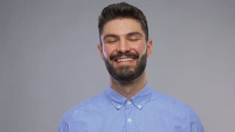 Happy-Portrait-of-Young-Man-Face-Looking-at-Camera-and-Smiling-in-Neon-Studio.Happy-Portrait-of-Young-Man-Looking-at-Camera-and-Smiling-in-Neon-Colored-Light.-Close-Up-View-on-Charming-White-Person-with-Cool-Grin.-Millennial-Model-Posing-Alone-in-Playful-Creative-Shoot-Inside