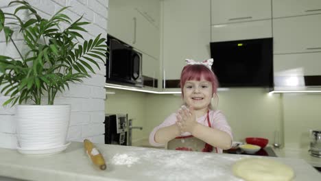 Cooking-pizza.-Little-child-playing-with-flour-gets-her-hands-dirty-in-kitchen