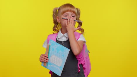 Funny-cute-kid-primary-school-girl-making-playful-silly-facial-expressions-fooling-around-with-pen