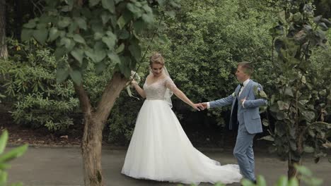 Newlyweds.-Caucasian-groom-with-bride-in-the-park.-Wedding-couple.-Happy-family