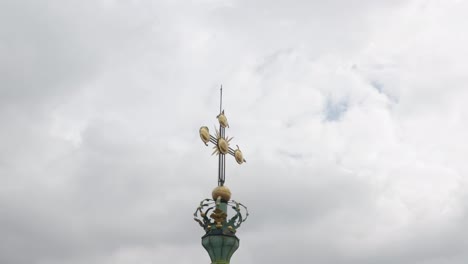 Aerial-drone-view-footage-of-Latin-Cathedral-church-dome-in-city-Lviv-Ukraine,-cloudy-sky-background