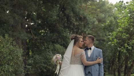 Newlyweds.-Caucasian-groom-with-bride-in-the-park.-Wedding-couple.-Happy-family