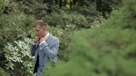 Groom,-brunette-young-man-in-the-park.-Wedding-day.-Businessman