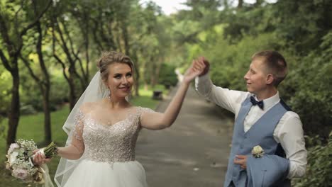 Newlyweds.-Caucasian-groom-with-bride-in-the-park.-Wedding-couple.-Happy-family