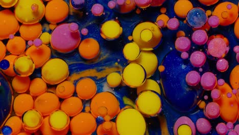 Bubbles-float-in-liquid-paint,-mixing-ink,-oil-and-milk,-abstract-multicolor-hypnotic-painting