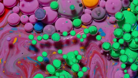 Bright-neon-colorful-bubbles-oil-and-ink,-acrylic-paint-moving-close-up,-wallpaper-background