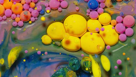 Yellow-neon-colorful-bubbles-oil-and-ink,-acrylic-paint-moving-close-up,-wallpaper-background