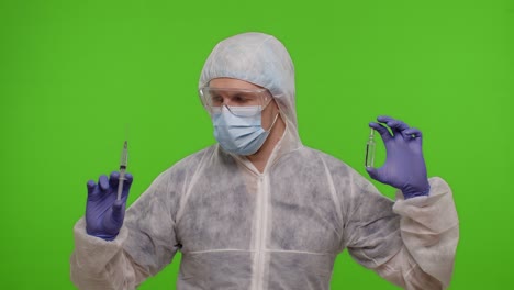 Doctor-in-PPE-suit-with-vaccine-ampoule,-syringe-in-hands-offering-vaccination-against-coronavirus