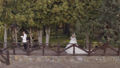 Lovely-newlyweds-caucasian-bride-and-groom-with-bouquet-in-park,-wedding-couple-first-meeting