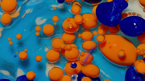 Macro-structure-of-multicolored-water-paint-oil-bubbles-movement,-bright-colorful-acrylic-painting