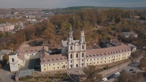 Aerial-view-of-catholic-cathedral-monastery-in-autumn.-City-Buchach,-Ukraine