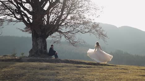 Newlyweds.-Caucasian-groom-with-bride-on-mountain-slope.-Wedding-couple.-Happy