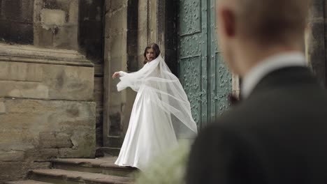 Newlyweds,-caucasian-groom-with-bride-walking,-embracing,-hugs-on-the-city-street,-wedding-couple