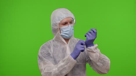 Doctor-in-PPE-suit-with-vaccine-ampoule,-syringe-in-hands-offering-vaccination-against-coronavirus