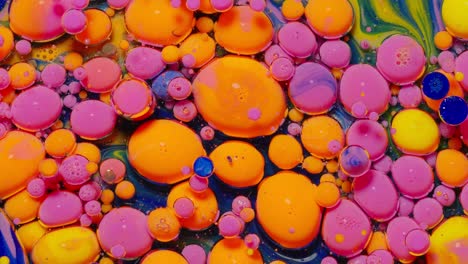 Macro-structure-of-multicolored-water-paint-oil-bubbles-movement,-bright-colorful-acrylic-painting