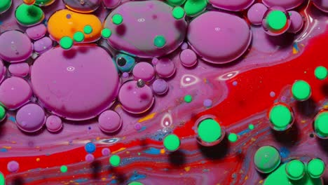 Bubbles-float-in-liquid-paint,-mixing-ink,-oil-and-milk,-abstract-multicolor-hypnotic-painting