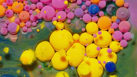 Bubbles-float-in-liquid-paint,-mixing-ink,-oil-and-milk,-abstract-multicolor-hypnotic-painting