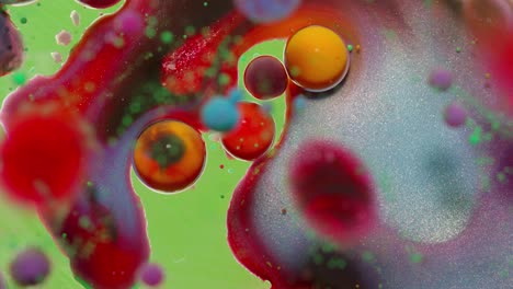 Bubbles-float-in-liquid-paint,-mixing-ink,-oil-and-milk,-abstract-multicolor-hypnotic-painting