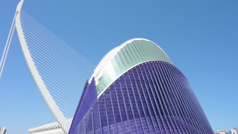 Tilt-down-view-of-the-CaixaForum-Valencia,-Agora,-as-people-visit-the-City-of-Arts-and-Sciences