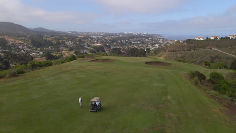 AERIAL---Golf-course-in-Zapallar,-Valparaiso,-Chile,-wide-forward-shot