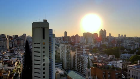 Aerial-rising-over-Recoleta-neighborhood-buildings-and-skyscrapers-at-golden-hour,-Buenos-Aires