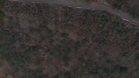 Aerial-view-above-a-rural-road-and-a-ravine-in-Barichara