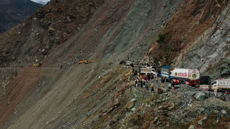 Landslide-At-Karakoram-Highway---Bulldozers-Clearing-Up-Road-Blocked-By-Boulders-And-Rocks-Affecting-Travellers-To-Pass-Mountain-Road-In-Dasu,-Pakistan