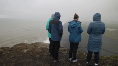 Iceland-black-sand-beach-overlook-with-three-people-watching