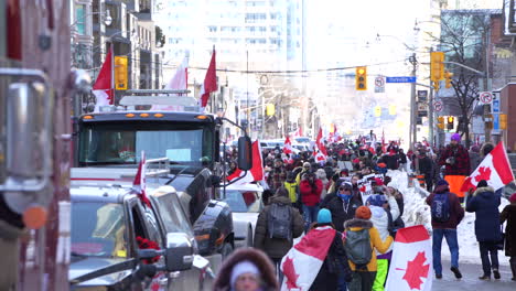 Large-crowds-with-truckers-blocking-roads-in-Toronto,-protesting-anti-covid-mandates