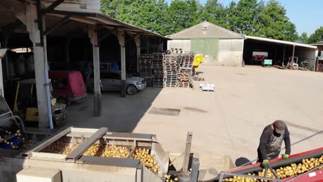 Potato-grader-machine-from-aerial-side-view-and-a-farm-yard