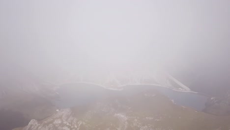 Foggy-Drone-flight-in-Alps-Lünersee-Lake-in-Austria-Vorarlberg